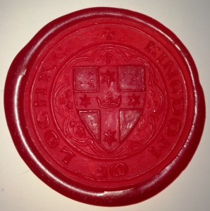 Lochac's Great Seal of State, as stamped into red wax. Photo by Lochac's College of Scribes.