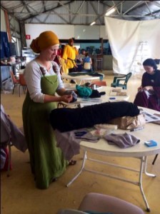 The Honourable Lady Heilwich Gheerts teaching her A&S class on fitting hosen. Photo by TH Lady Ceara Shionnach, November 2014.