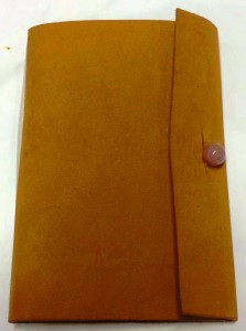The event token for Canterbury Faire AS49 was a small leather book for writing event notes in. Photo by THL Ceara Shionnach, January 2015.
