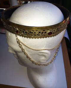 The second coronet worn by Mistress Rowan Perigrynne as Baroness of Rowany. This coronet was a gift to Mistress Rowan from SCAdians in the U.S. during the Kingdom Shopping Expedition in 1982. Photo by THL Ceara Shionnach, 2014.