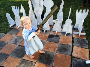 Baby, boffer and giant chess outside the Kinder Keep. Photo by TH Lady Ceara Shionnach, June 2015.