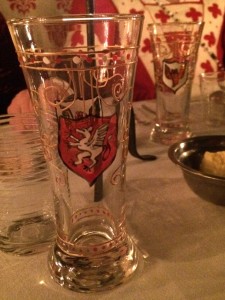The painted glasses that were gifted to the guests had the PACC winged cornucopia badge on one side and the Politarchopolis griffin on the other. Photo by THB Ceara Shionnach, July 2015.
