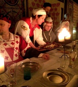 The wait staff wore red and white tabards and spent the night working hard, treating the guests like high nobility. Photo by THB Ceara Shionnach, July 2015.