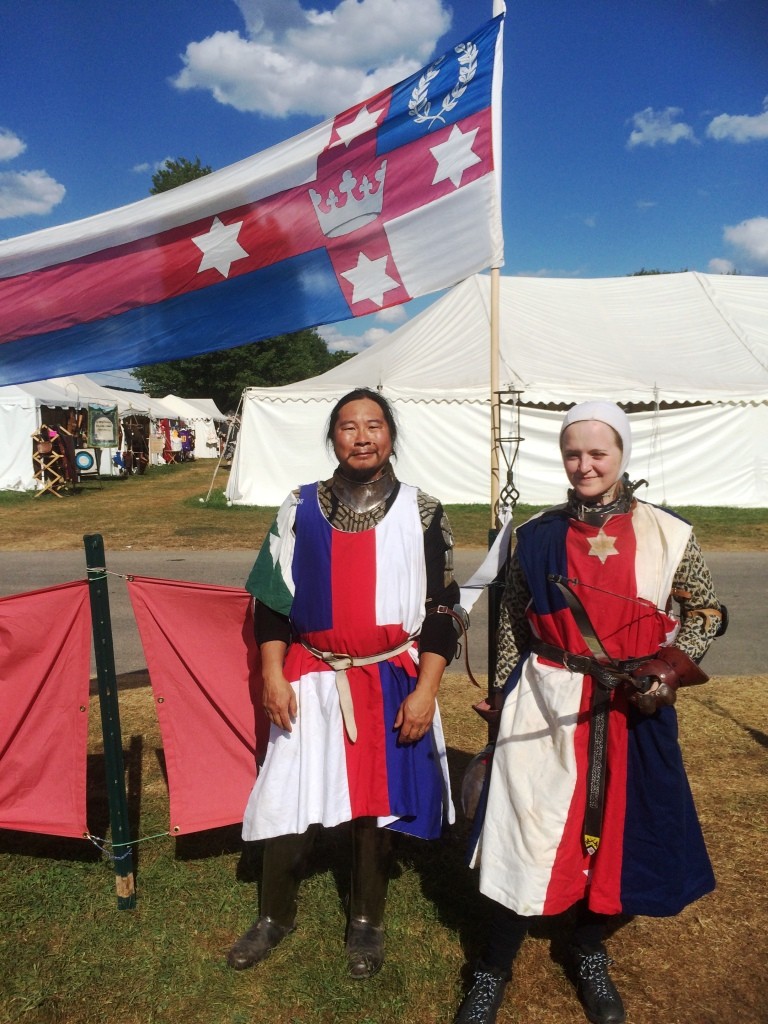 Count Kinggiyadai and Baroness Ameline prepare to represent Lochac as combat archers. Photo by THB Ceara Shionnach, August 2015.