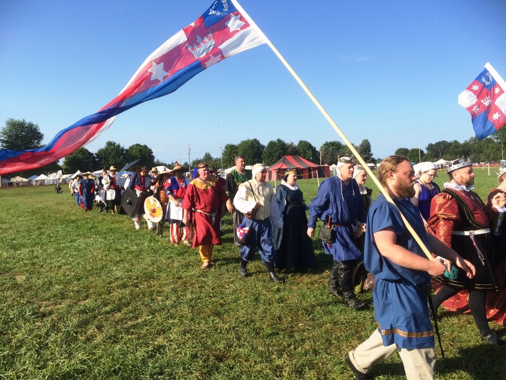 The Lochac procession into Opening Court at Pennsic War 44. Photo by THB Ceara Shionnach, August 2015.