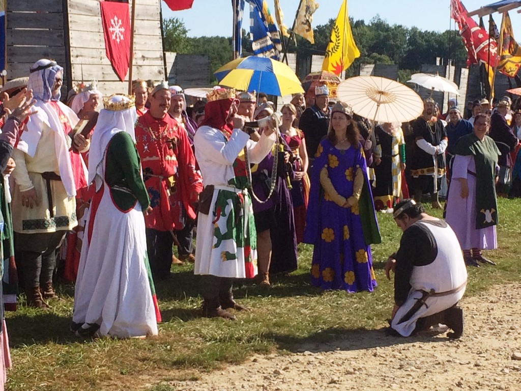 King Ragnvaldr of the Middle Kingdom blows the war horn, signifying the start of Pennsic War. Photo by THB Ceara Shionnach, August 2015.